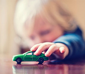 Kid playing with car at the first street jersey city apartments for rent